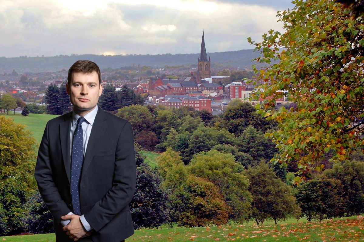 Robert Largan's parliamentary portrait superimposed on the skyline of Chesterfield with its famous crooked church spire.