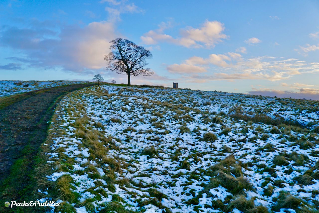 Climbing to the Cage at Lyme Park, Disley in the snow