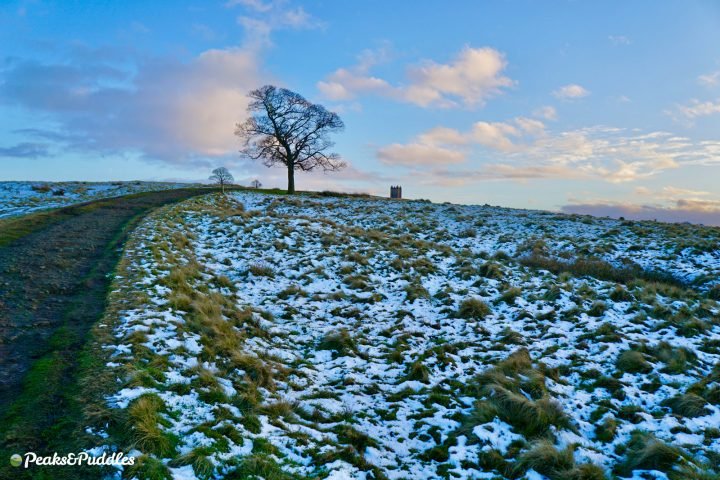 Climbing to the Cage at Lyme Park, Disley in the snow