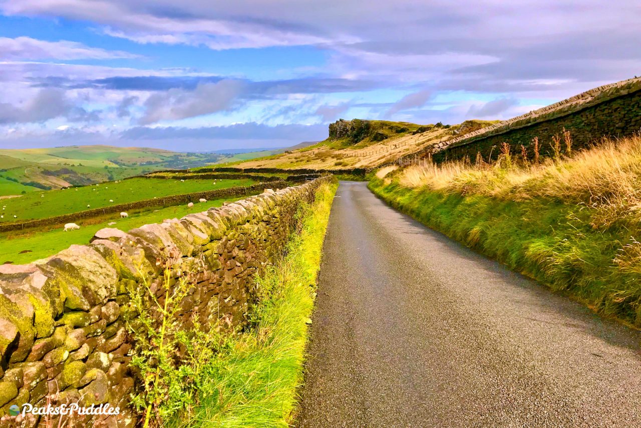 Descending by bike past Windgather Rocks near Kettleshulme and Goyt Valley
