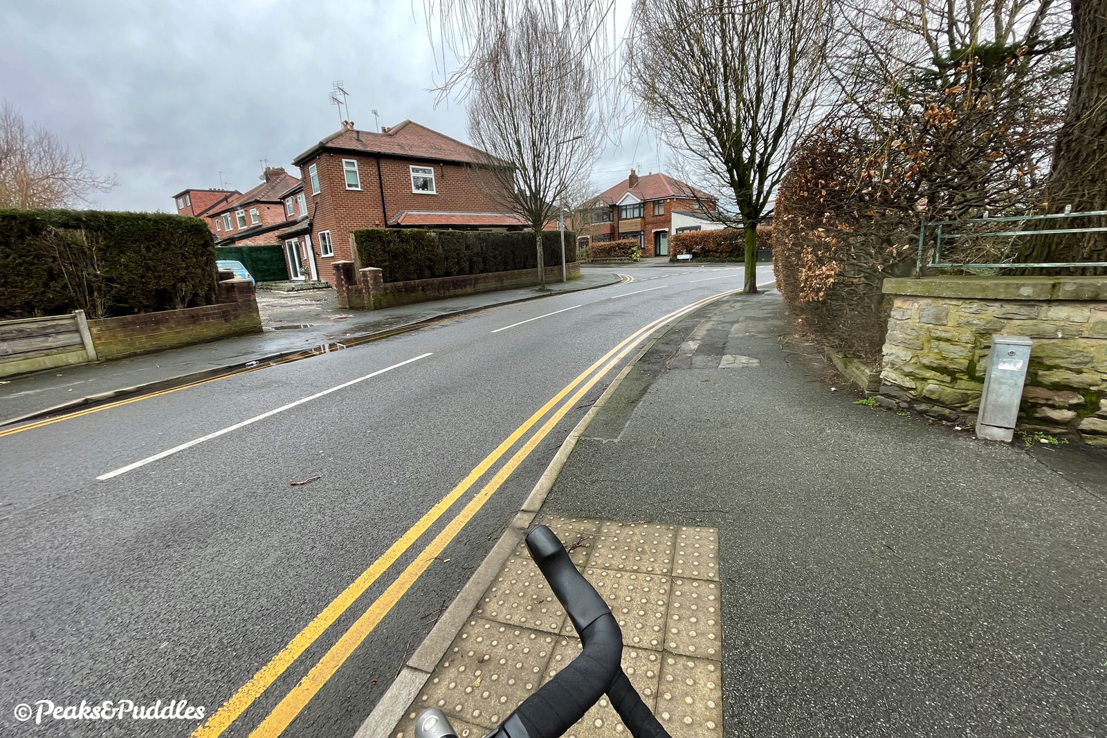 A blind turn onto a road from a cycle path.