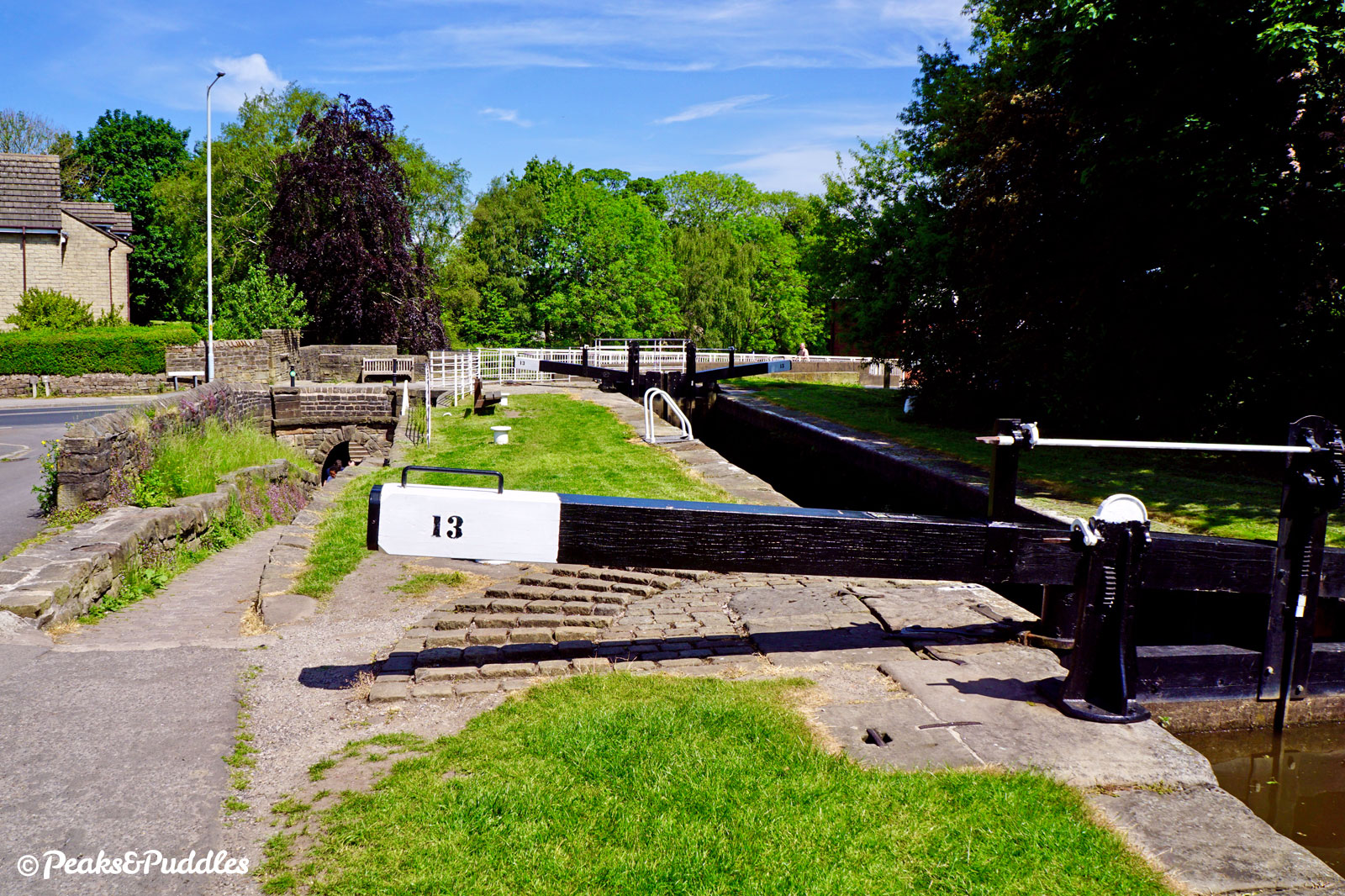 The "Posset Bridge" has arches for the horse tunnel, the main canal below Lock 13 and a blocked-up third arch which once served a branch to Oldknow's Lime Kilns.