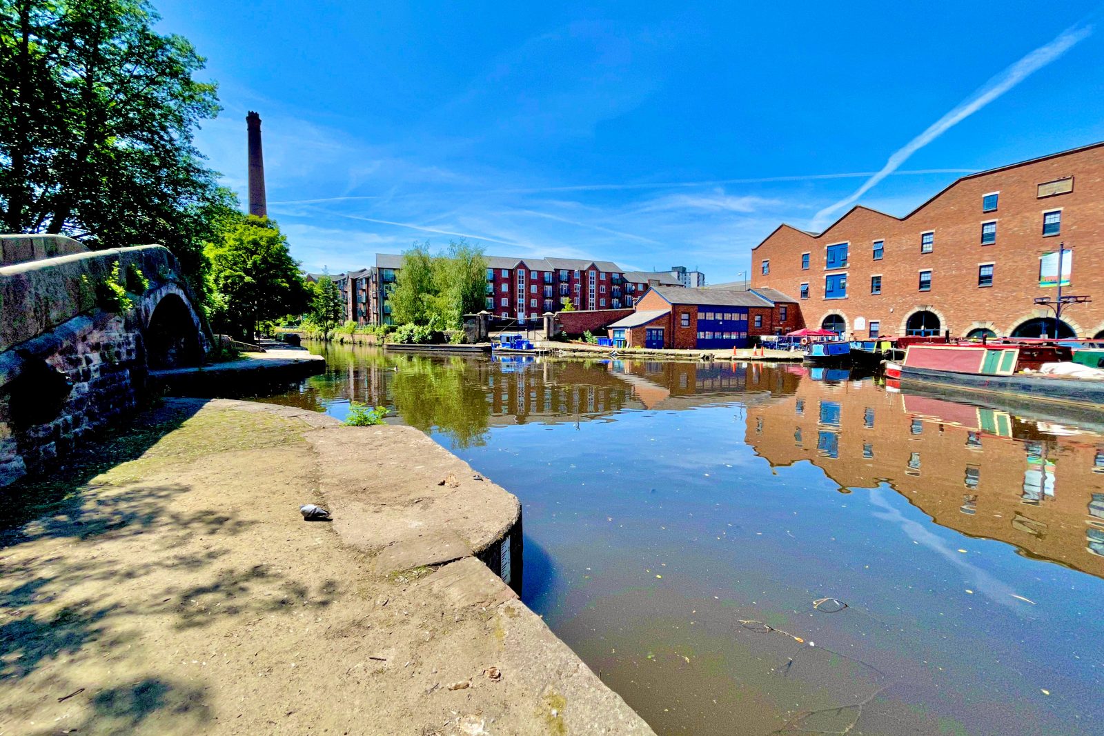 The Peak Forest Canal ends at Dukinfield Junction, where it meets the Ashton Canal opposite the warehouse now housing Portland Basin Museum.