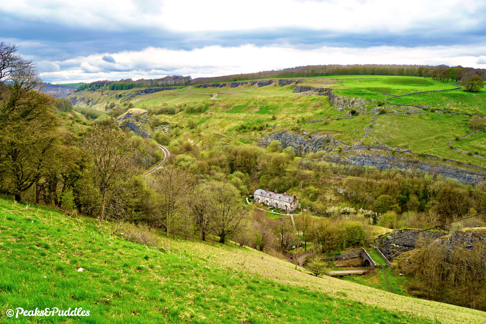 High above Monsal Trail, a lay-by on the A6 offers this stunning view over Blackwell Mill, showing the remaining Great Rocks quarry line curving around one side of what was once a large triangular junction surrounding the cottages. The trail is bottom right.